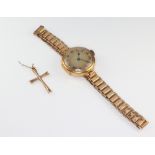 A lady's 9ct gold cased wristwatch on a gilt strap together with a 9ct yellow gold cross pendant