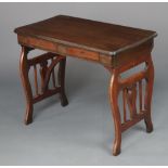An Edwardian mahogany folding campaign writing table fitted 2 frieze drawers, raised on pierced