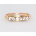 A yellow metal 6 stone diamond ring, approx. 0.3ct, size P 1/2