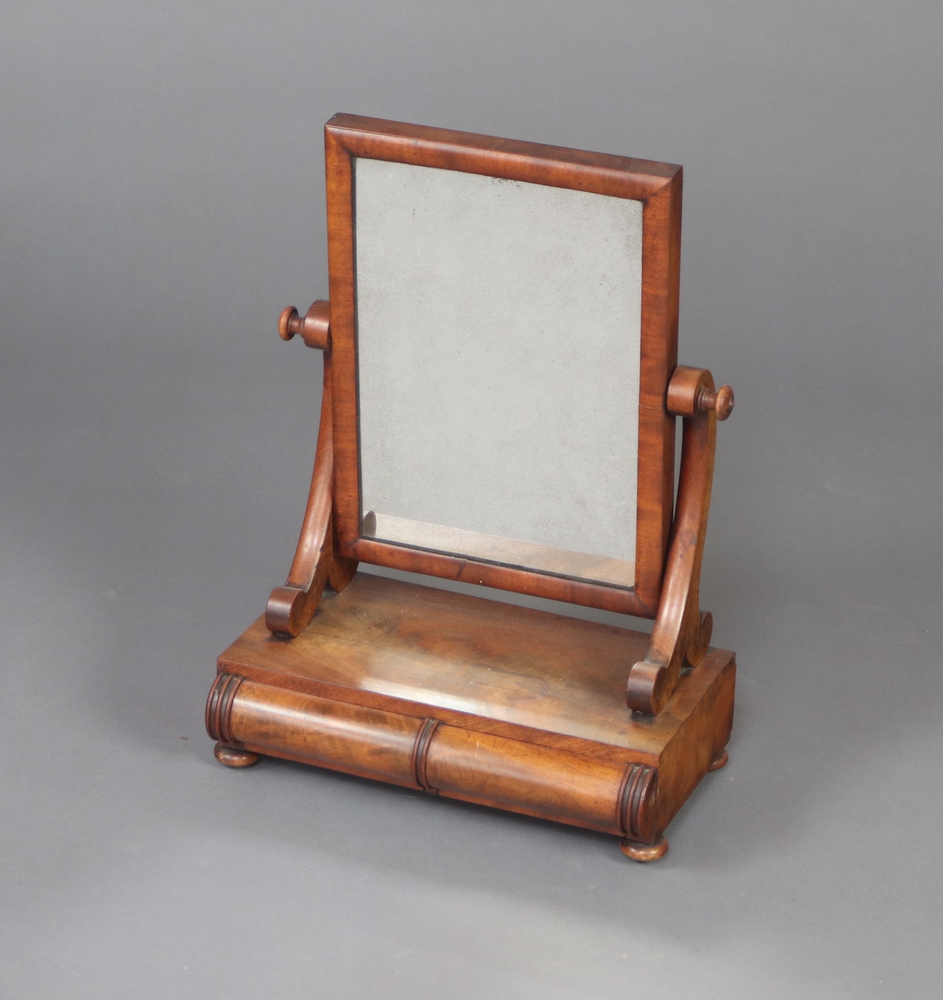 A Victorian rectangular plate dressing table mirror, raised on a shaped base fitted 2 drawers, on