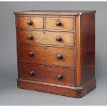 A Victorian bleached mahogany D shaped chest of 2 short and 3 long drawers with turned handles,