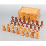 A 20th Century turned wooden Staunton chess set, boxed