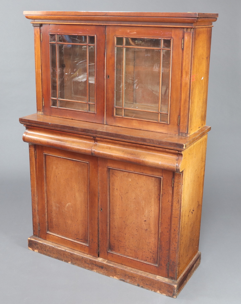 A Victorian mahogany chiffonier with raised back fitted a shelf enclosed by astragal glazed panelled