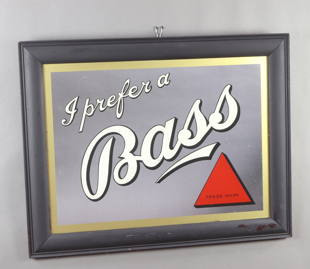 A 1930's Bass advertising mirror "I Prefer a Bass" contained in an oak frame 71cm h x 91cm w