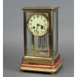 J Marti, a French 8 day striking 4 glass clock with 9cm dial, Roman numerals contained in a gilt