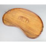 An Edwardian kidney shaped inlaid mahogany tea tray, the centre inlaid musical trophies 58cm x