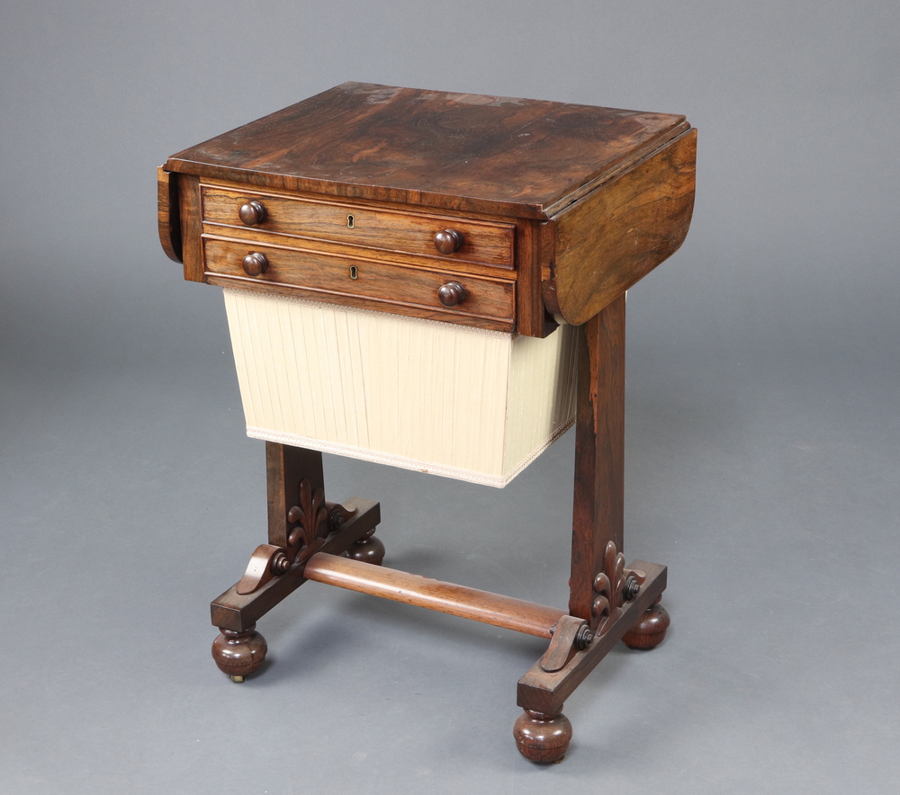 A William IV rectangular rosewood work table fitted a frieze drawer above basket, raised on standard