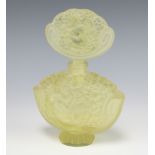 An Art Deco style yellow moulded glass scent bottle and stopper depicting naked reclining ladies