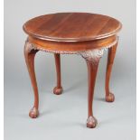 An Edwardian circular Chippendale style mahogany occasional table raised on cabriole claw and ball