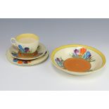 A Clarice Cliff crocus pattern tea cup, saucer, size plate and ditto shallow bowl The cup is cracked