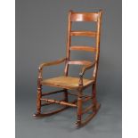 A 19th Century elm ladder back rocking chair with woven rush seat 110cm x 53cm w x 66cm d (seat 29cm