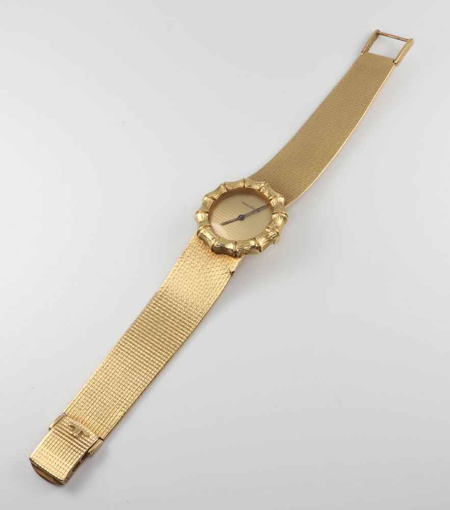 A lady's 18ct yellow gold Jaeger Le Coultre wristwatch contained in a bamboo effect 25mm case