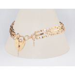 A 9ct yellow gold gate bracelet with heart padlock 7.5 grams