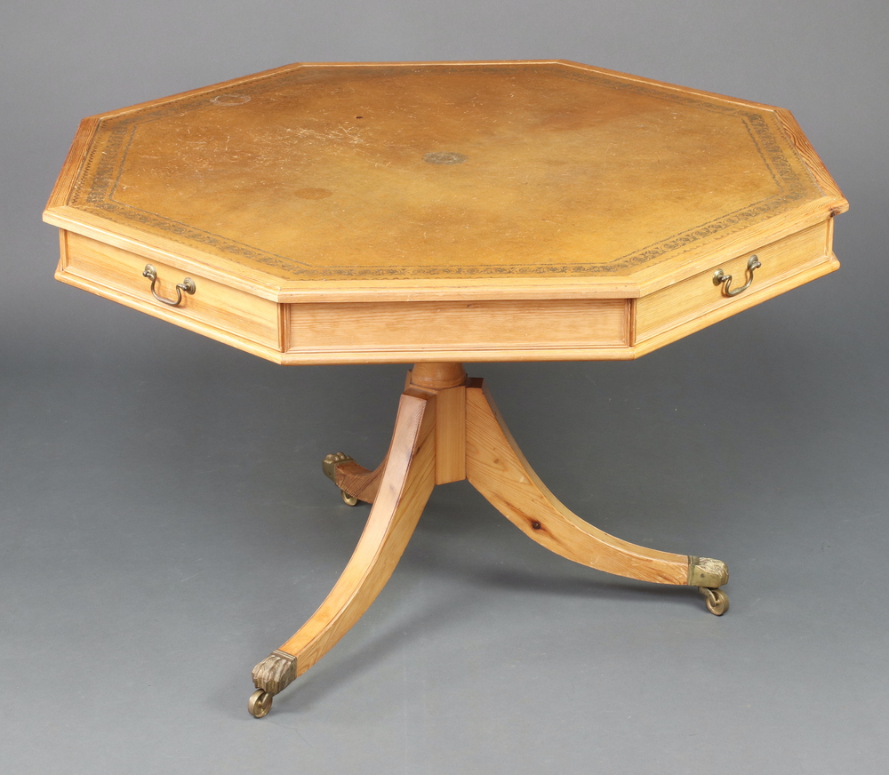 A Georgian style octagonal pine drum table with brown leather inset top, fitted 4 frieze drawers,