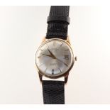 A 9ct yellow gold Emperor calendar wristwatch contained in a 32mm case with a leather strap This