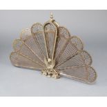 A Victorian style pierced gilt metal peacock spark guard 62cm h x 91cm w Crude pin repair to the