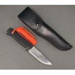 A Fallkniven Thermorun handled knife with 13cm blade contained in a black leather scabbard marked F1