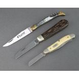 A Laguiole Rossignol folding pocket knife with 8cm blade marked 2476 with corkscrew and horn grip, a