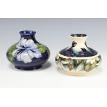 A modern Moorcroft squat baluster vase decorated the Juneberry pattern by Anji Davenport,