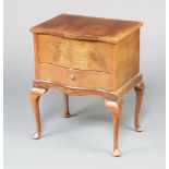 A Queen Anne style walnut sewing box of serpentine outline, the hinged lid revealing a fitted