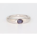 A white metal stamped 750 amethyst ring, size O 1/2