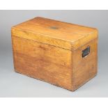 A Victorian rectangular oak plate trunk with iron drop handles and brass plaque to the top marked