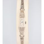 An Art Deco diamond set platinum wristwatch on a steel bracelet This watch is not working