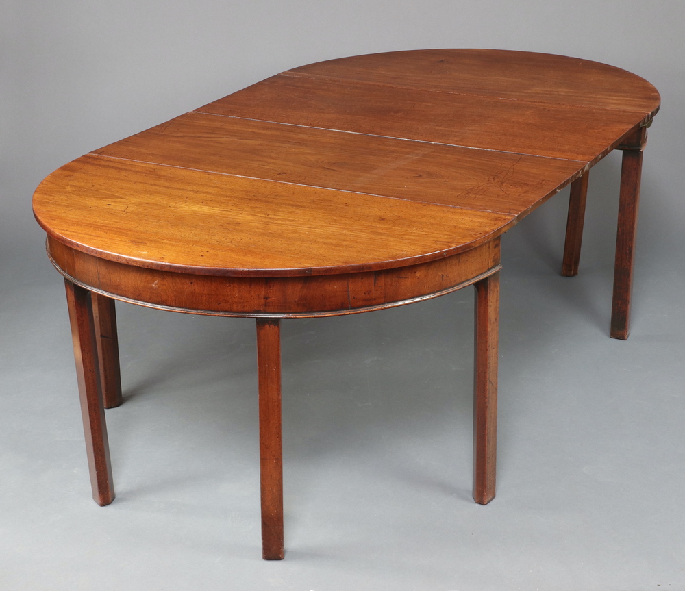 A Georgian mahogany D end dining table with 2 extra leaves, raised on 8 square supports 71cm h x