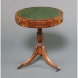 A Georgian style circular mahogany drum table with green inset writing surface fitted 3 drawers,