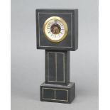A West German timepiece in the form of a longcase clock with 5cm dial contained in a slate case 24cm