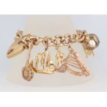 A 9ct yellow gold charm bracelet 71 grams