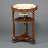 A Victorian circular mahogany basin stand with ceramic basin, raised on turned and fluted column,