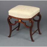An Edwardian rectangular inlaid mahogany stool with overstuffed seat, raised on cabriole supports