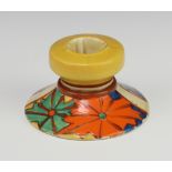 A Clarice Cliff Bizarre pattern candle holder decorated with flowers no.331 5cm