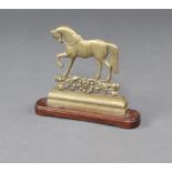 A 19th Century brass and mahogany door stop in the form of a walking horse 35cm h x 39cm w x 9cm d