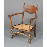An Edwardian mahogany and beech open arm bar back chair with woven cane seat 78cm h x 67cm w x