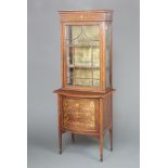 An Edwardian inlaid mahogany display cabinet on cabinet, the upper section fitted shelves enclosed