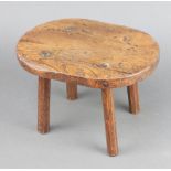An 18th/19th Century oval elm stool raised on turned supports 19cm h x 31cm w x 23cm d Some