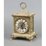 A French style striking mantel clock with Roman numerals contained in a gilt metal case 25cm h x
