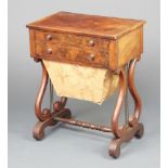 A Victorian rectangular mahogany work table with quarter veneered top fitted 2 drawers above a