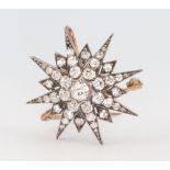 A Victorian yellow metal diamond star brooch approx. 1.7ct, 7 grams, 30mm