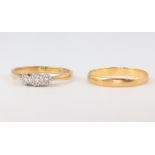 An 18ct yellow gold illusion set 3 stone diamond ring, approx 0.05ct, size N, 2.3 grams, together