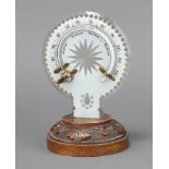 A 19th Century shaped and cut glass thermometer raised on a carved mahogany base 20cm x 12cm Some