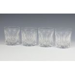 A set of 4 heavily cut glass tumblers 10cm