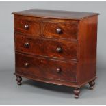A 19th Century mahogany bow front chest of 2 short and 2 long drawers, raised on bun feet 92cm h x