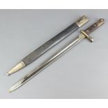 A Spanish bayonet, the blade marked 41868 complete with leather scabbardThere is a split to metal