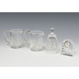 A Waterford Crystal timepiece 8cm, 2 jugs 10cm and a barrel 11cm