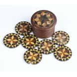 Seven Victorian Tunbridge Ware gaming counters 25mm (1 a/f) contained in a ditto box