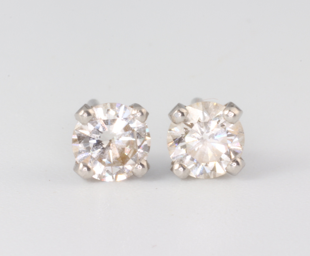 A pair of white metal single stone brilliant cut diamond ear studs, each approx 0.5ct