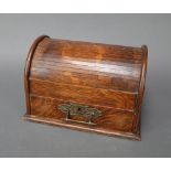 A Victorian oak dome shaped smoker's cabinet with tambour shutter, the base fitted a drawer with
